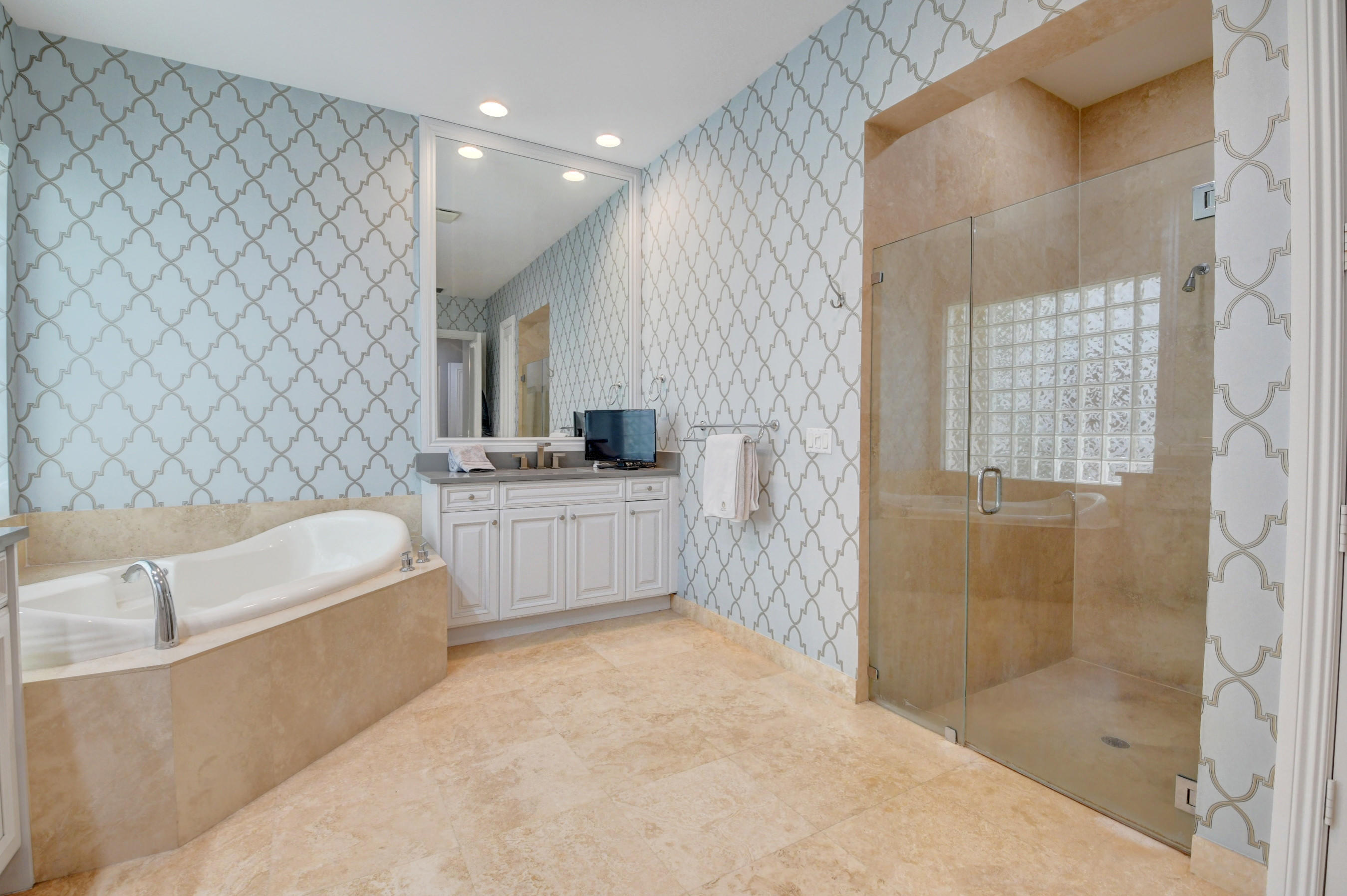 17798 Cadena Drive Boca Raton, FL 33496 - Photo 18 of 49 a bathroom with a tub a sink and a shower