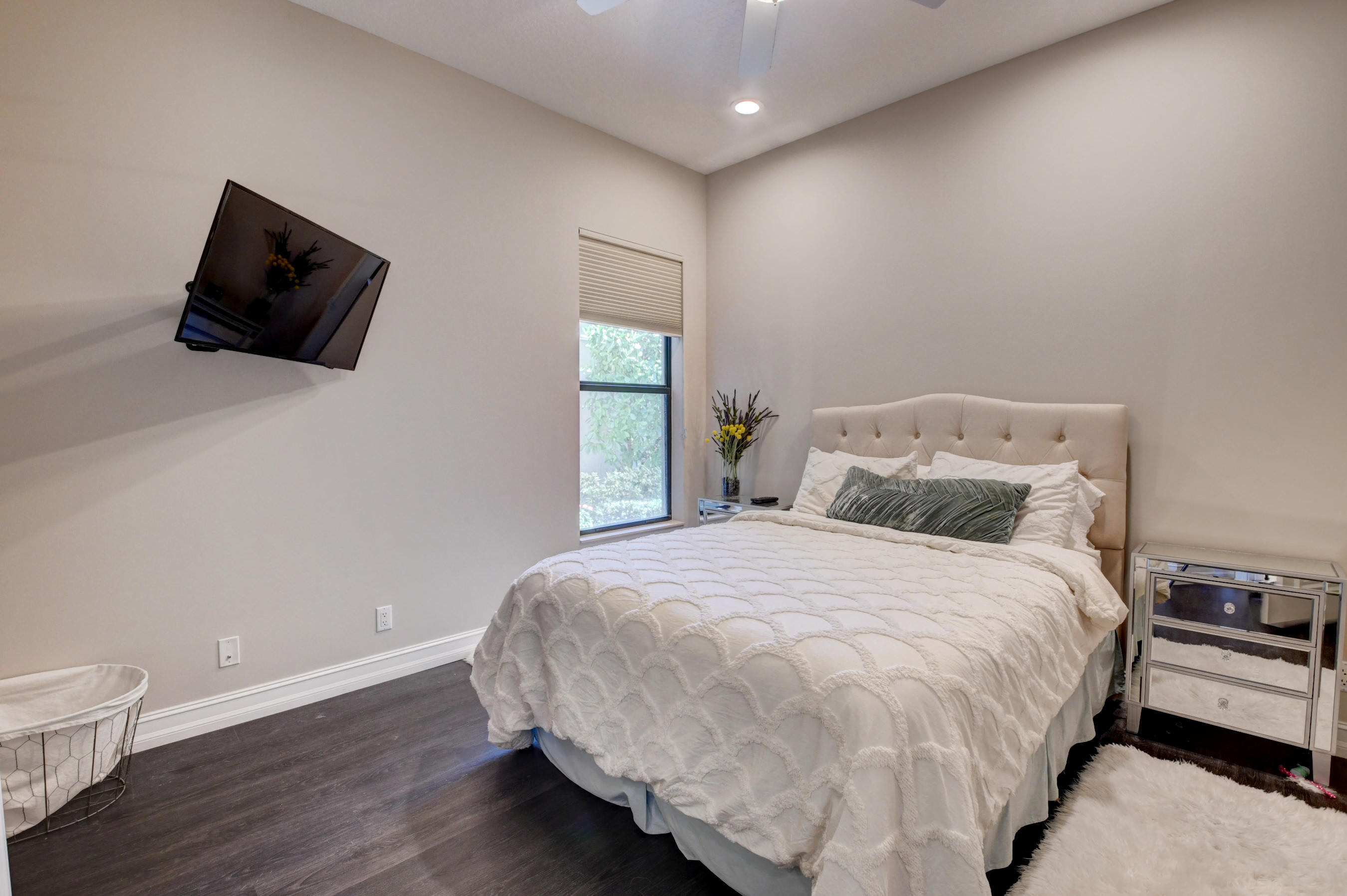 17798 Cadena Drive Boca Raton, FL 33496 - Photo 19 of 49 a bedroom with a bed and wooden floor