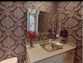 17798 Cadena Drive Boca Raton, FL 33496 - Photo 21 of 49 a bathroom with a sink and a mirror