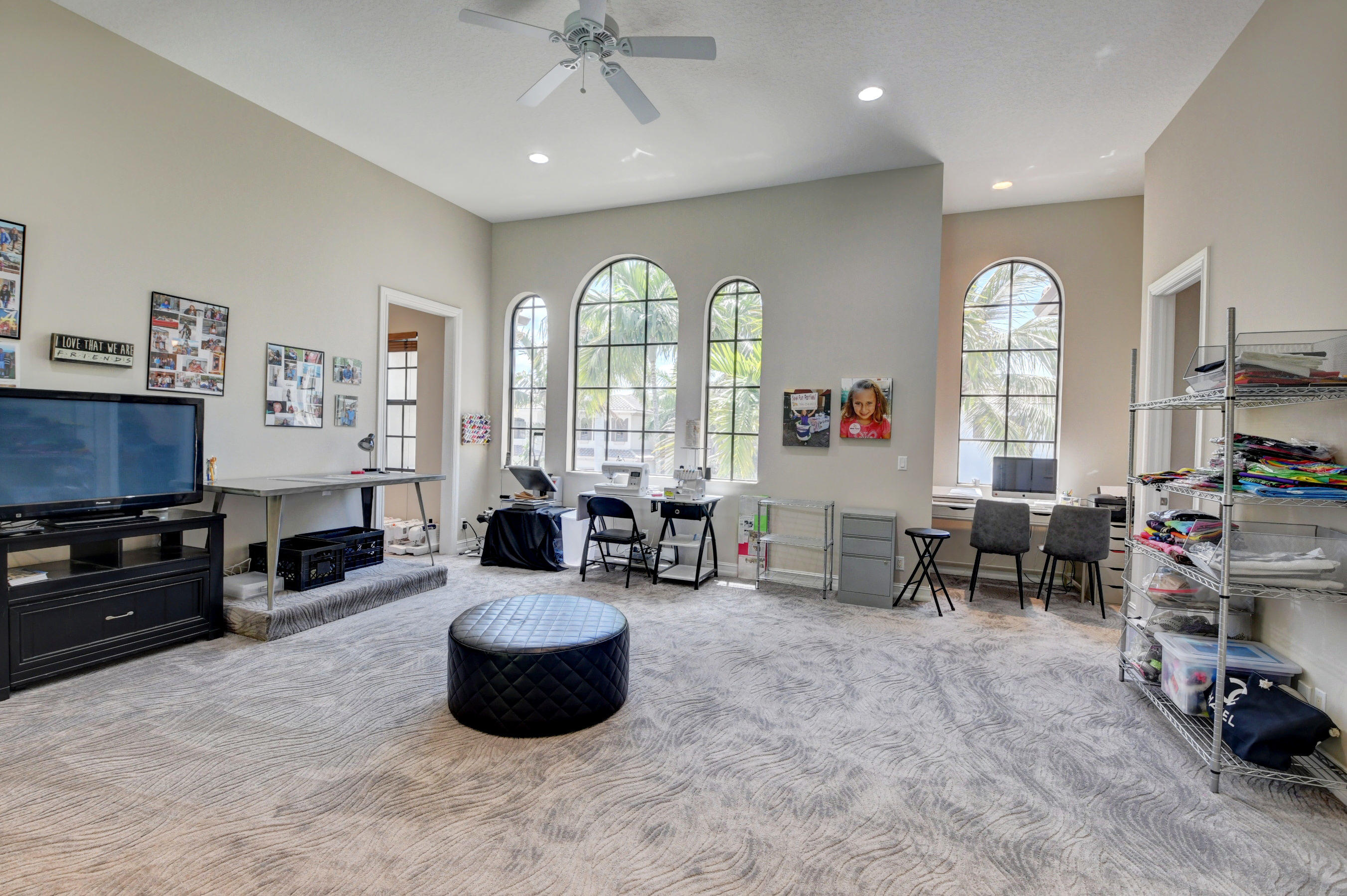 17798 Cadena Drive Boca Raton, FL 33496 - Photo 22 of 49 a large living room with furniture a fireplace and a large window