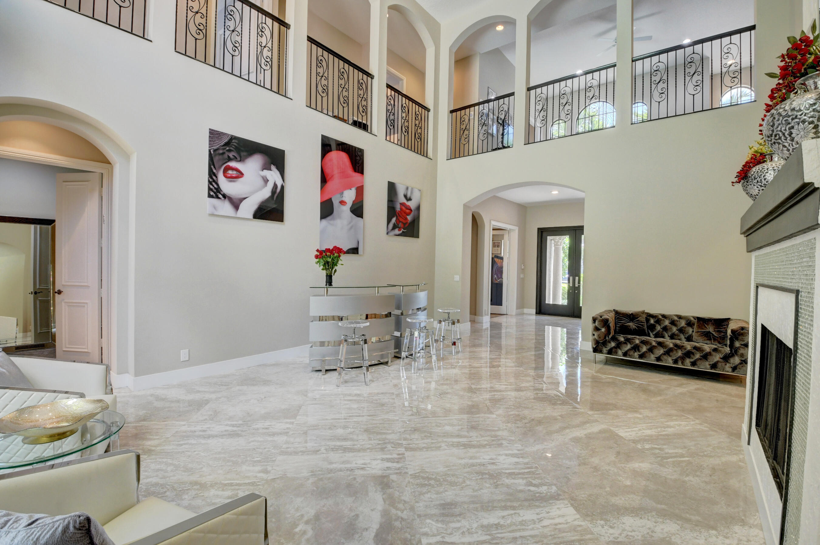 17798 Cadena Drive Boca Raton, FL 33496 - Photo 4 of 49 a group of white couches sitting in a kitchen next to a window