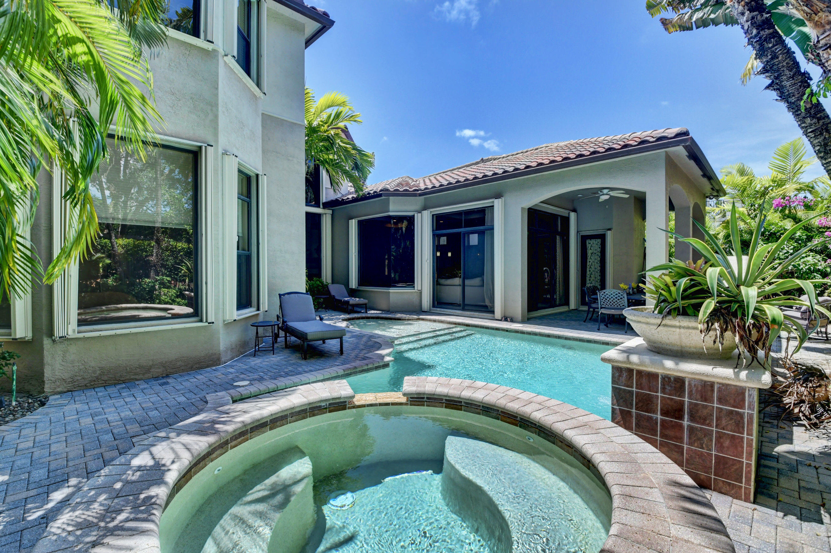 17798 Cadena Drive Boca Raton, FL 33496 - Photo 36 of 49 a swimming pool with outdoor seating yard and porch