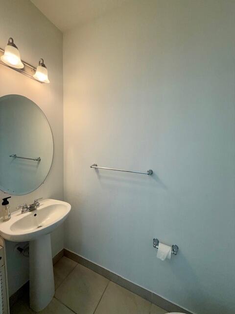 10092 Brickhill Drive Boca Raton, FL 33428 - Photo 10 of 42 a bathroom with a sink a toilet and mirror