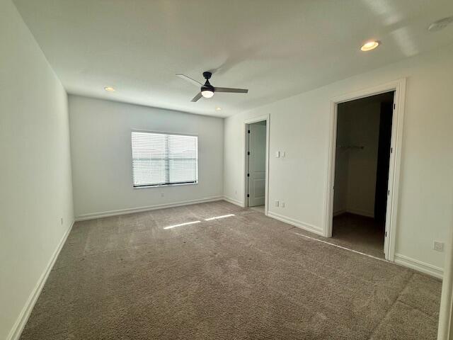 10092 Brickhill Drive Boca Raton, FL 33428 - Photo 11 of 42 an empty room with windows and ceiling fan