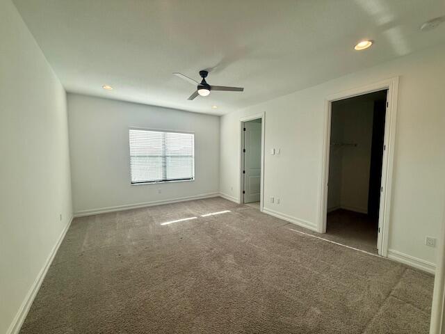 10092 Brickhill Drive Boca Raton, FL 33428 - Photo 12 of 42 an empty room with windows and ceiling fan