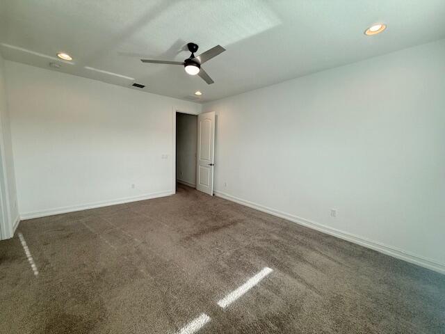 10092 Brickhill Drive Boca Raton, FL 33428 - Photo 13 of 42 an empty room with a ceiling fan and carpet