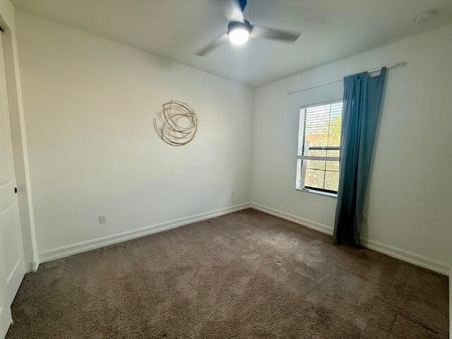 10092 Brickhill Drive Boca Raton, FL 33428 - Photo 19 of 42 an empty room with a window and ceiling fan