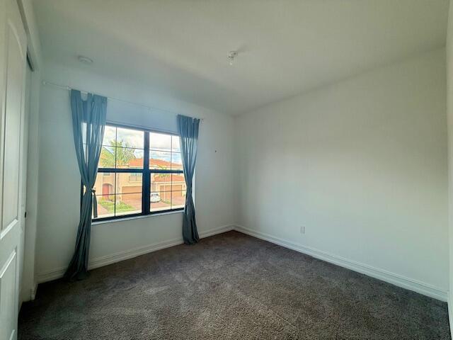 10092 Brickhill Drive Boca Raton, FL 33428 - Photo 20 of 42 an empty room with a window