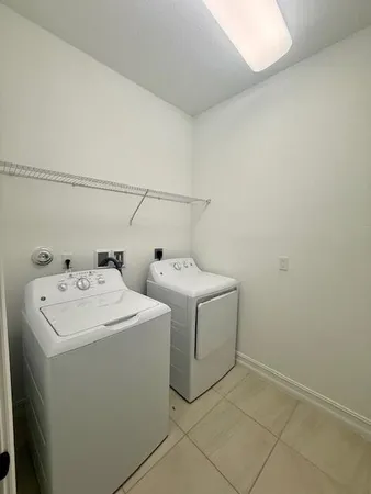 a bathroom with a sink a toilet a mirror and shower
