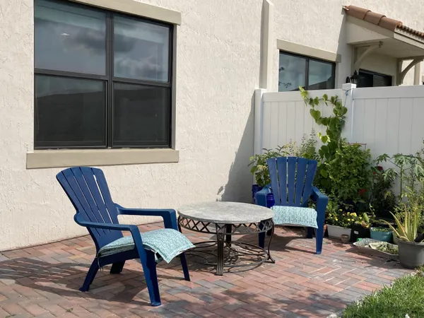 a view of a backyard with sitting area