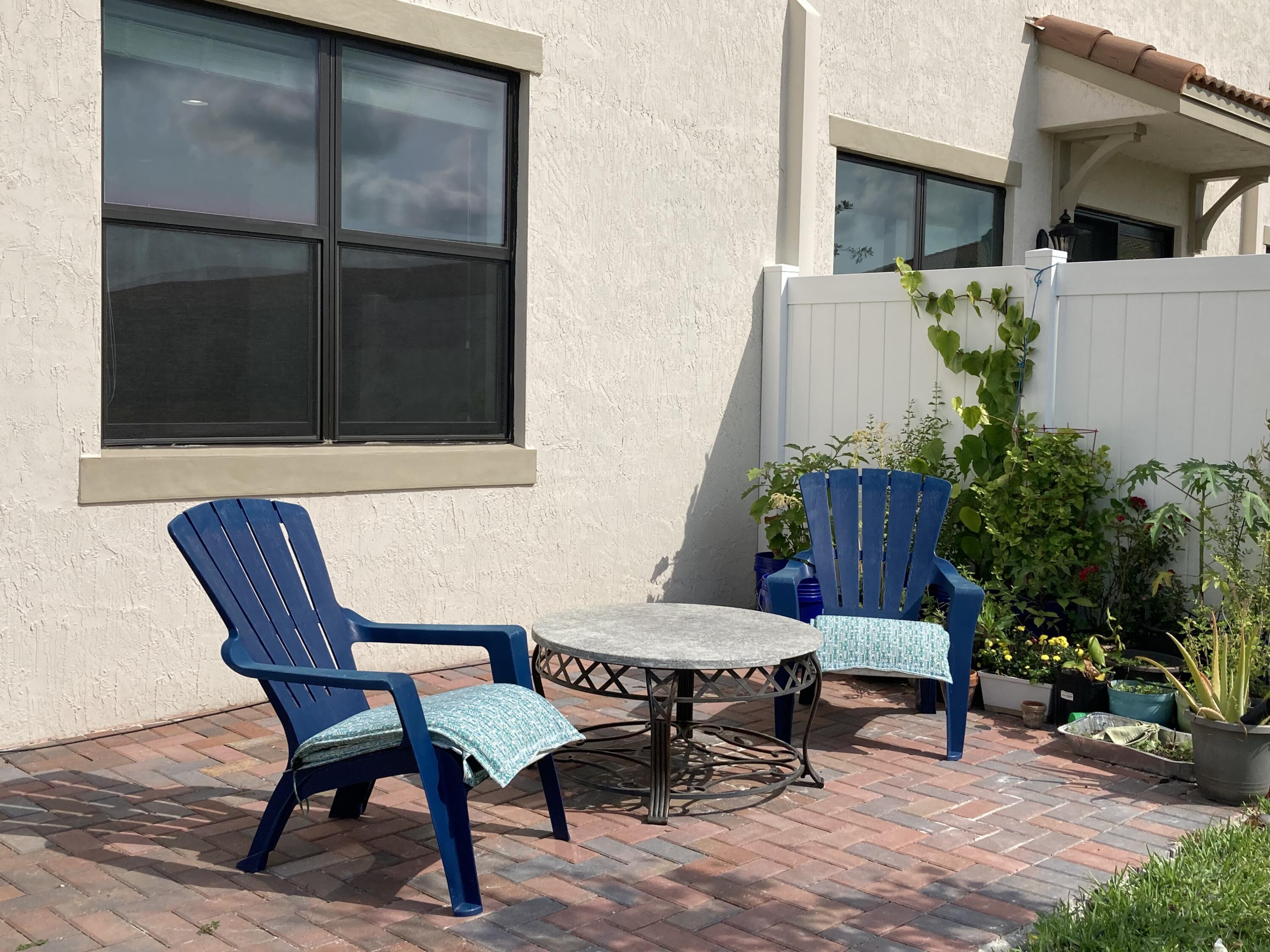 10092 Brickhill Drive Boca Raton, FL 33428 - Photo 24 of 42 a outdoor space with a couch and a potted plant