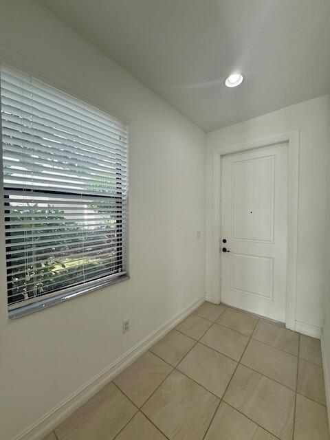 10092 Brickhill Drive Boca Raton, FL 33428 - Photo 3 of 42 a view of an empty room with a window