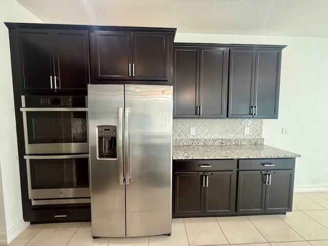 10092 Brickhill Drive Boca Raton, FL 33428 - Photo 6 of 42 a kitchen with granite countertop stainless steel appliances and cabinets