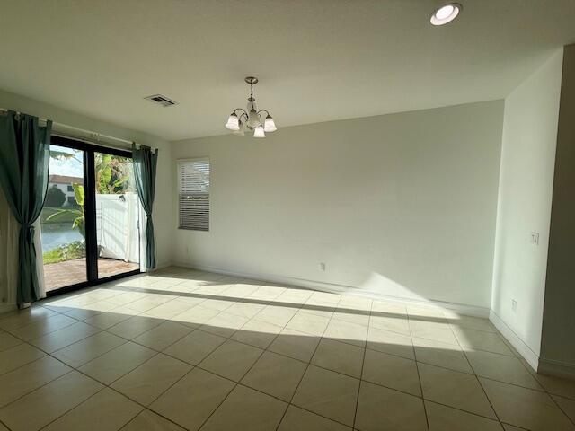 10092 Brickhill Drive Boca Raton, FL 33428 - Photo 7 of 42 a view of an empty room with a window