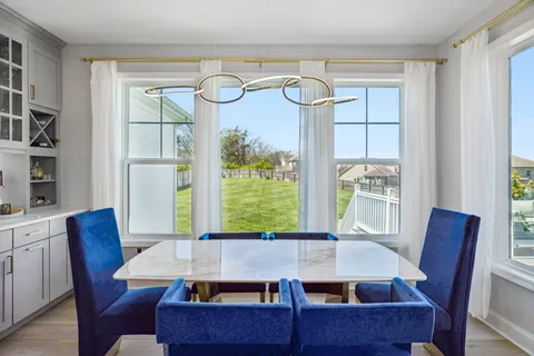 a living room with furniture a window and a fireplace