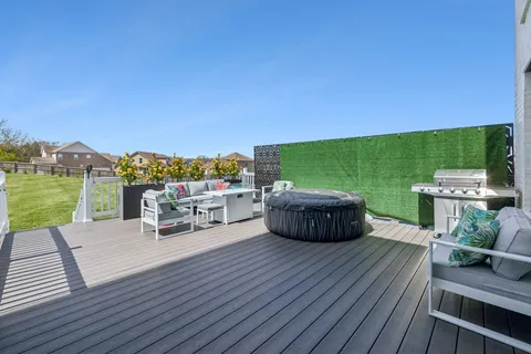 a aerial view of a house with swimming pool and a yard