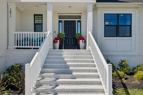 a large kitchen with stainless steel appliances kitchen island a large island in the center