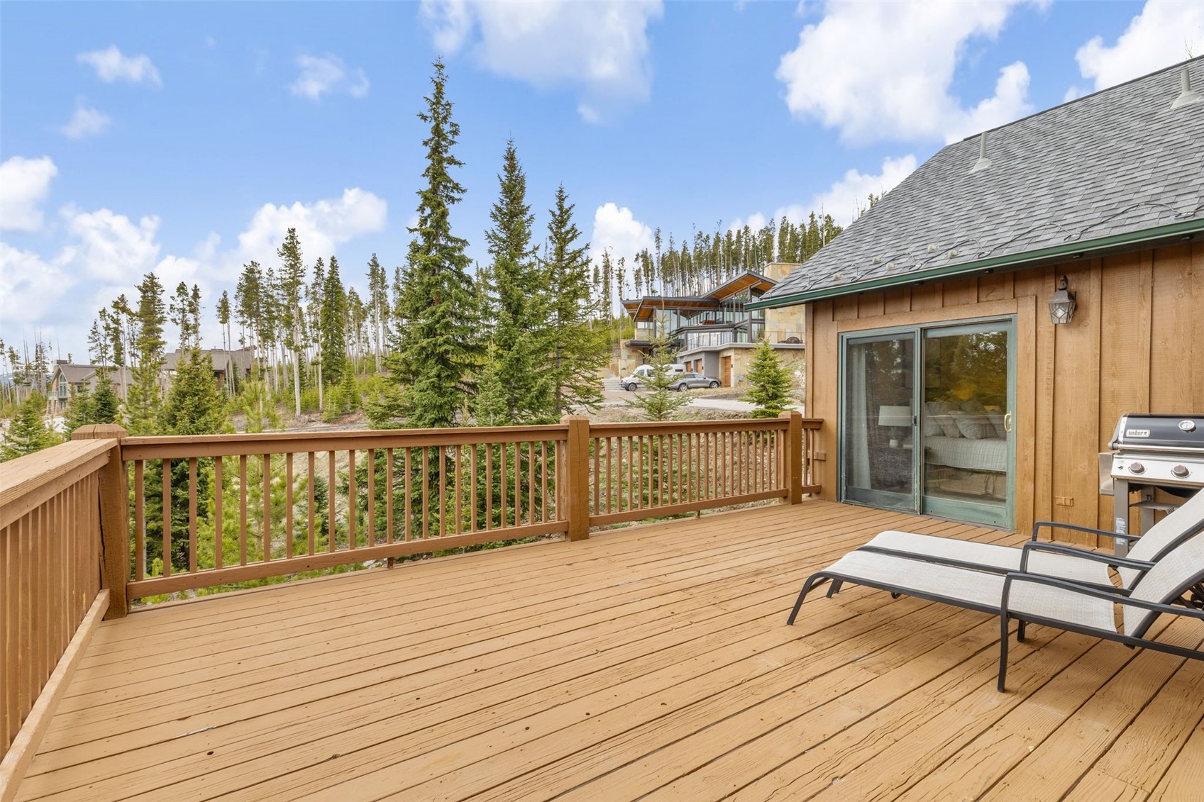 91795 Ryan Gulch Road Silverthorne, CO 80498 - Photo 28 of 50 a view of a balcony with wooden floor and outdoor seating