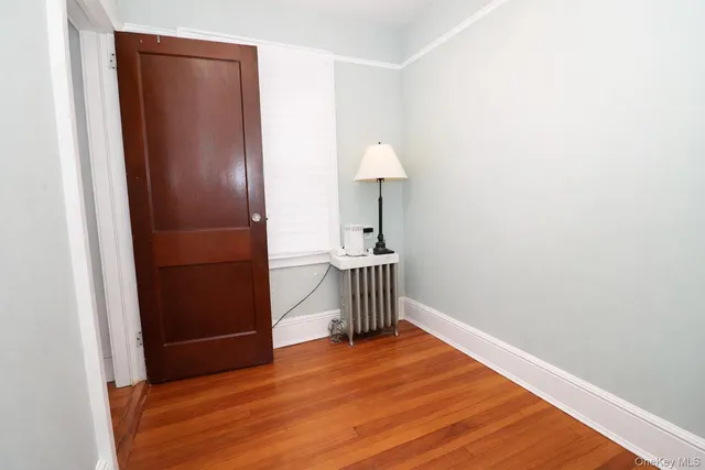 a view of a livingroom with wooden floor