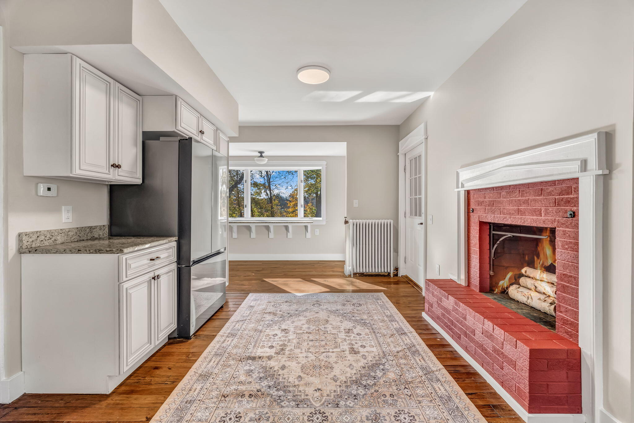 180 Main Road North Hampden, ME 04444 - Photo 15 of 129 Kitchen - Fireplace virtual stage