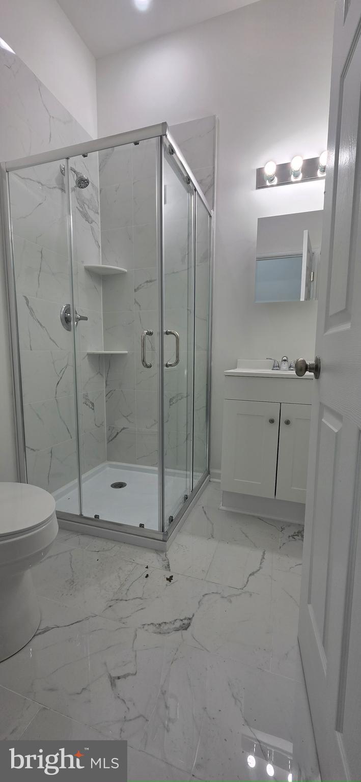 2233 North 16th Street Philadelphia, PA 19132 - Photo 11 of 21 a bathroom with a shower and a toilet