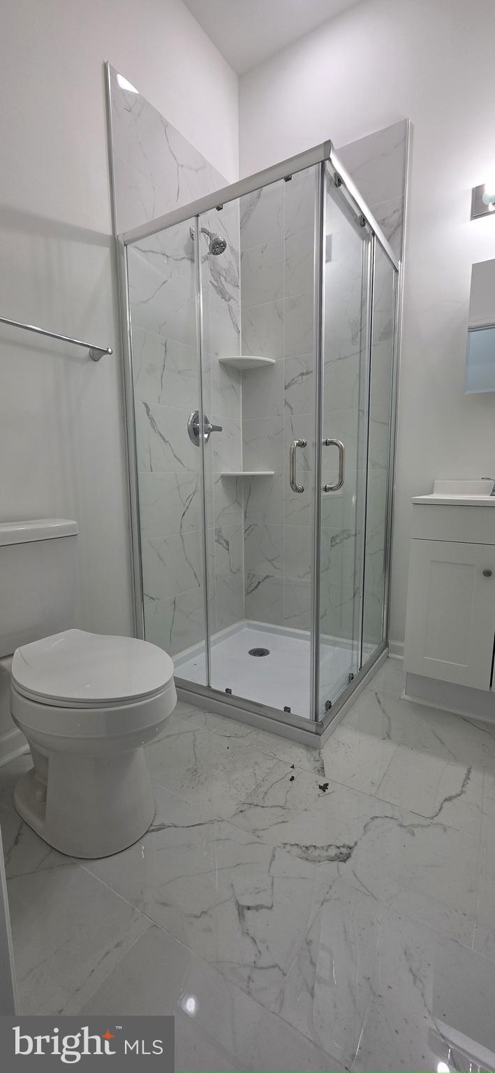 2233 North 16th Street Philadelphia, PA 19132 - Photo 12 of 21 a bathroom with a toilet and a shower