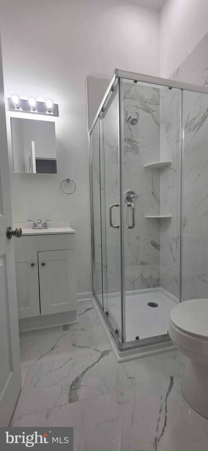 2233 North 16th Street Philadelphia, PA 19132 - Photo 4 of 21 a bathroom with a shower and toilet