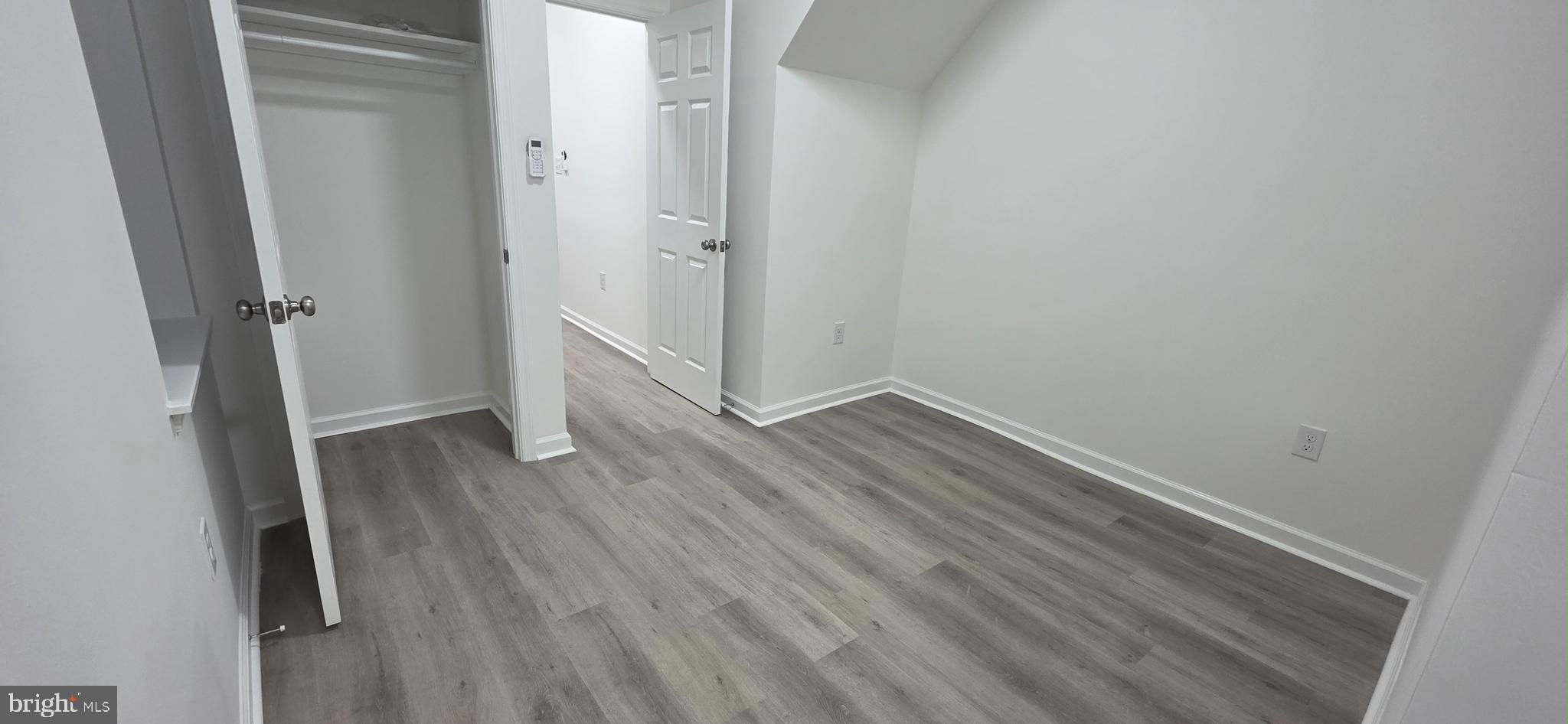 2233 North 16th Street Philadelphia, PA 19132 - Photo 9 of 21 a view of a room with wooden floor