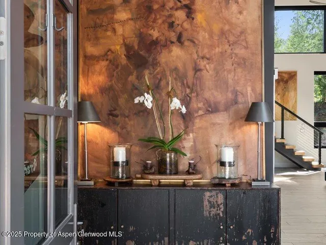 a view of a brick building next to a yard