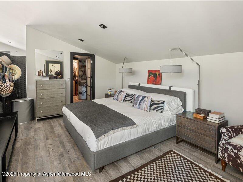 26 Bunker Loop Aspen, CO 81612 - Photo 18 of 23 a bedroom with a bed and a dresser