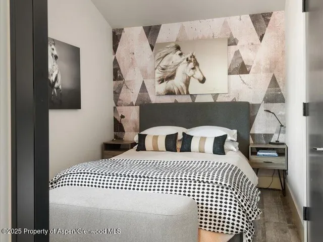 a view of a bedroom with a white walls