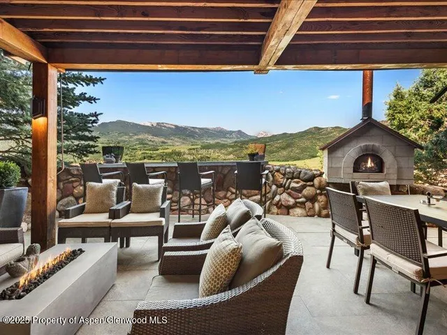 a view of balcony with couch and chairs