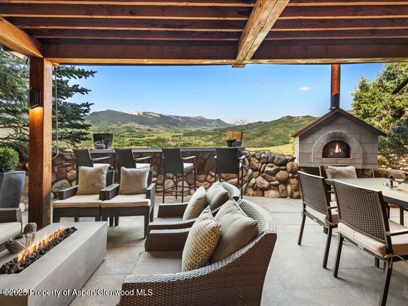 26 Bunker Loop Aspen, CO 81612 - Photo 3 of 23 a view of balcony with couch and chairs