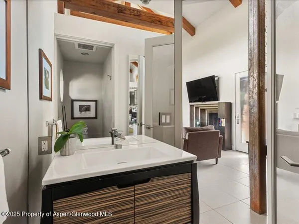a kitchen with a sink a counter space and stainless steel appliances