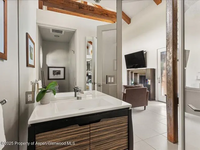 a kitchen with a sink a counter space and stainless steel appliances