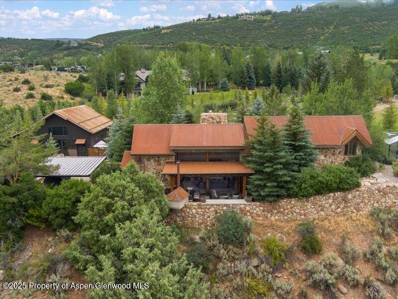 26 Bunker Loop Aspen, CO 81612 - Photo 9 of 23 an aerial view of a house with pool lake view and mountain view