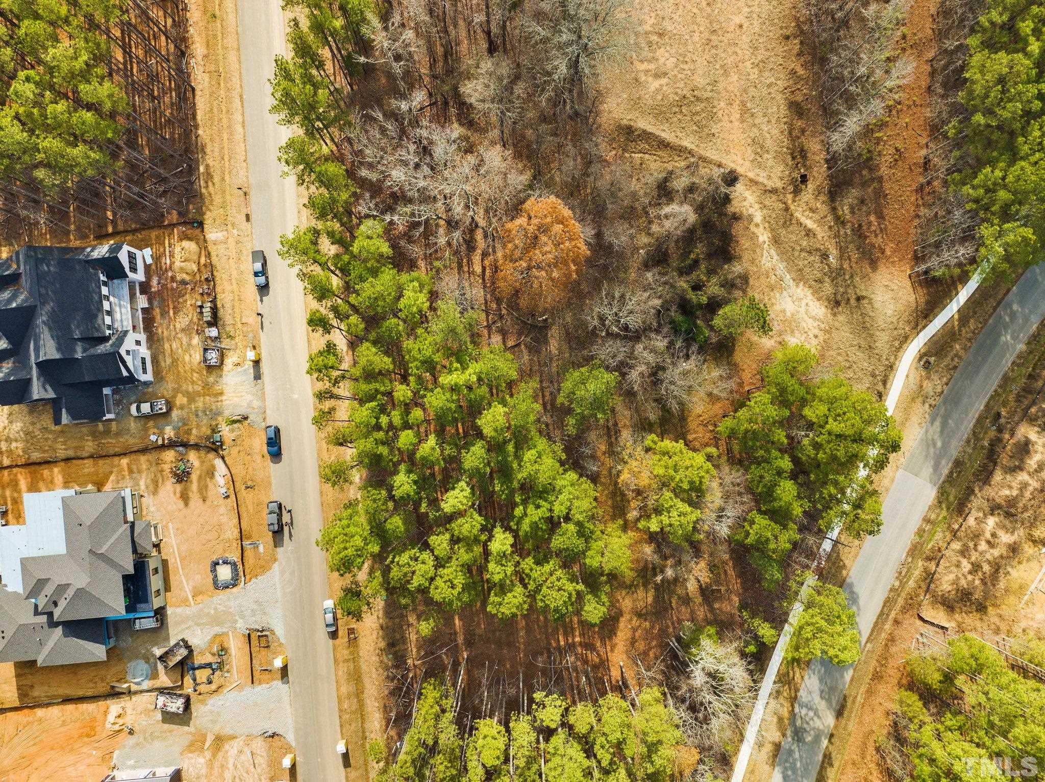 a view of residential house with parking space
