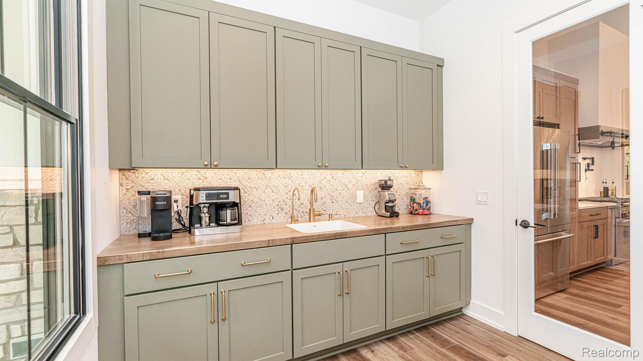 7101 Toma Road Dexter, MI 48130 - Photo 24 of 84 Butlers pantry functions as a prep-kitchen.