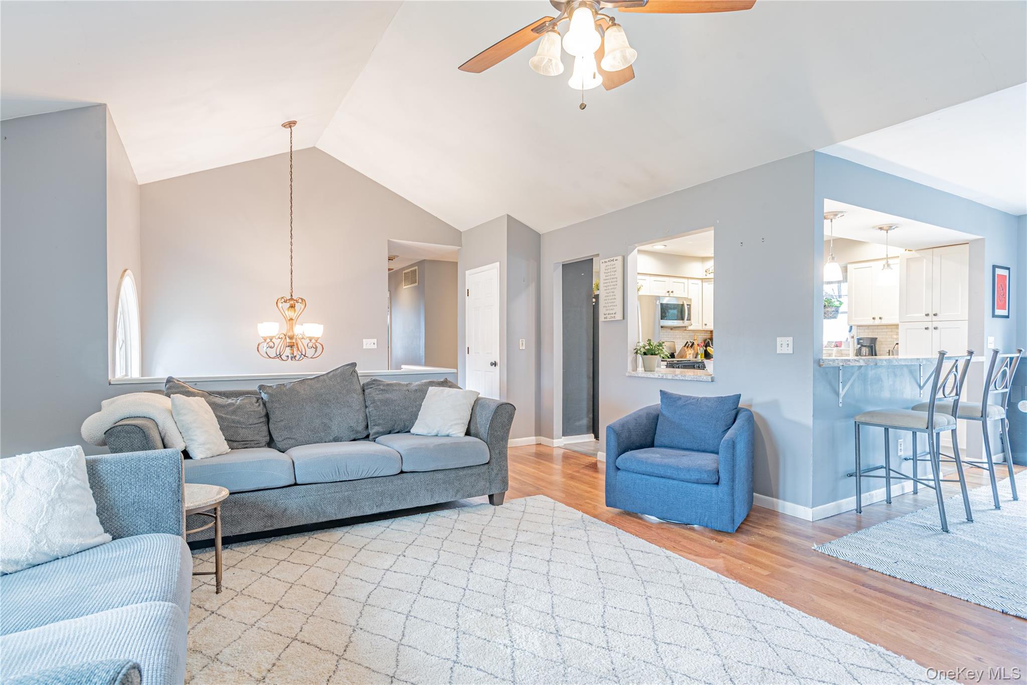 105 Oak Ridge Road Hopewell Junction, NY 12533 - Photo 11 of 32 a living room with furniture and a chandelier