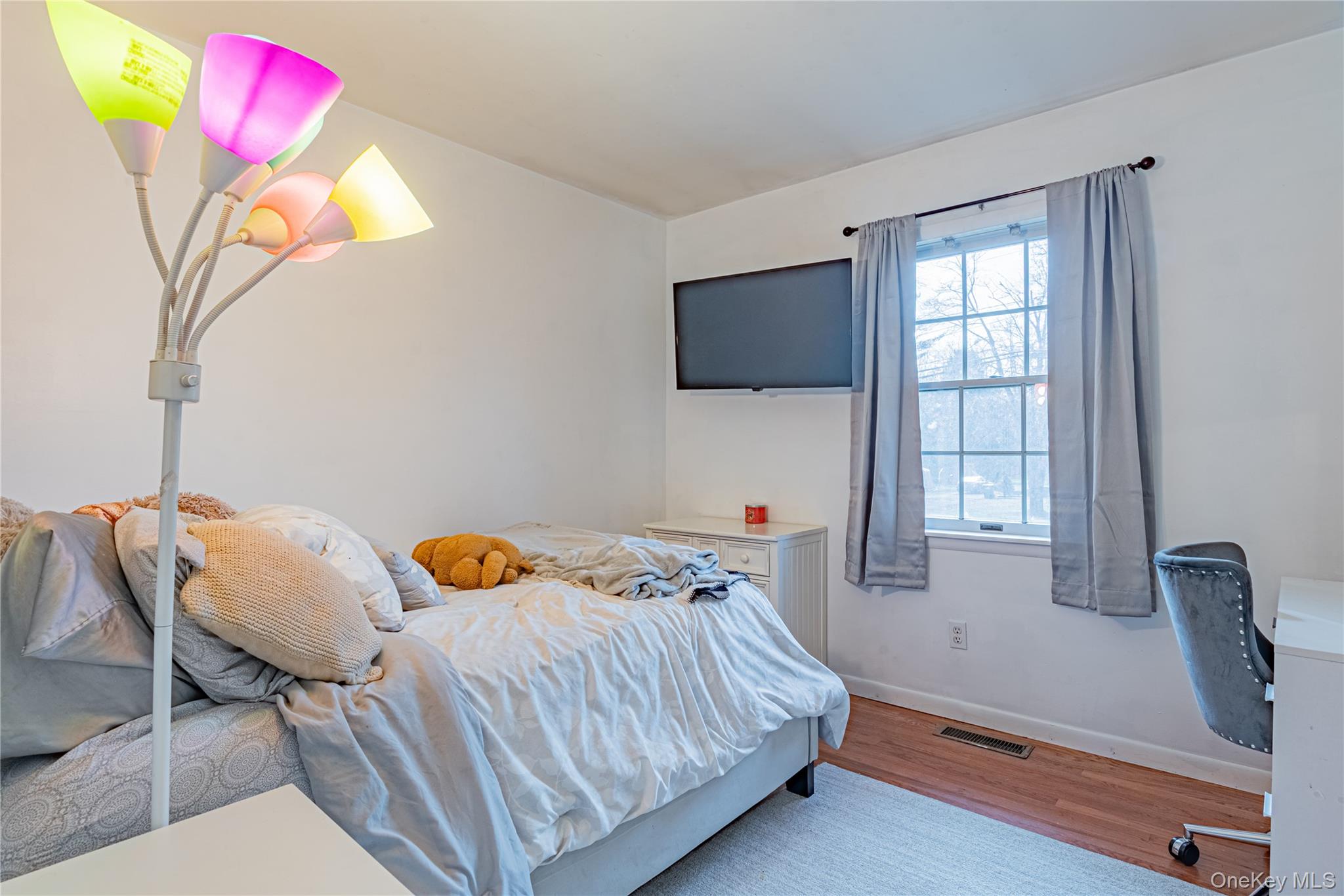 105 Oak Ridge Road Hopewell Junction, NY 12533 - Photo 19 of 32 a bedroom with a bed and a flat screen tv