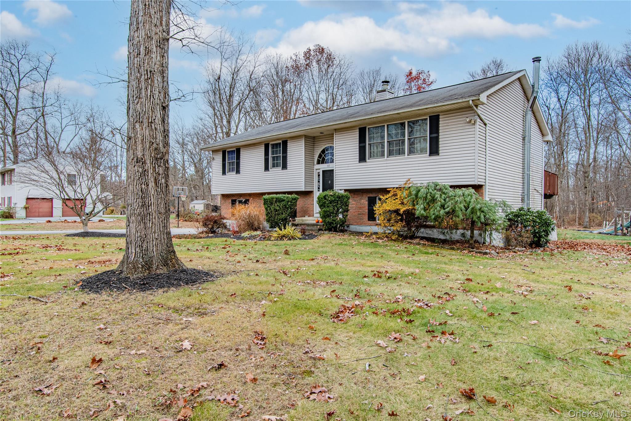 105 Oak Ridge Road Hopewell Junction, NY 12533 - Photo 2 of 32 a front view of a house with garden