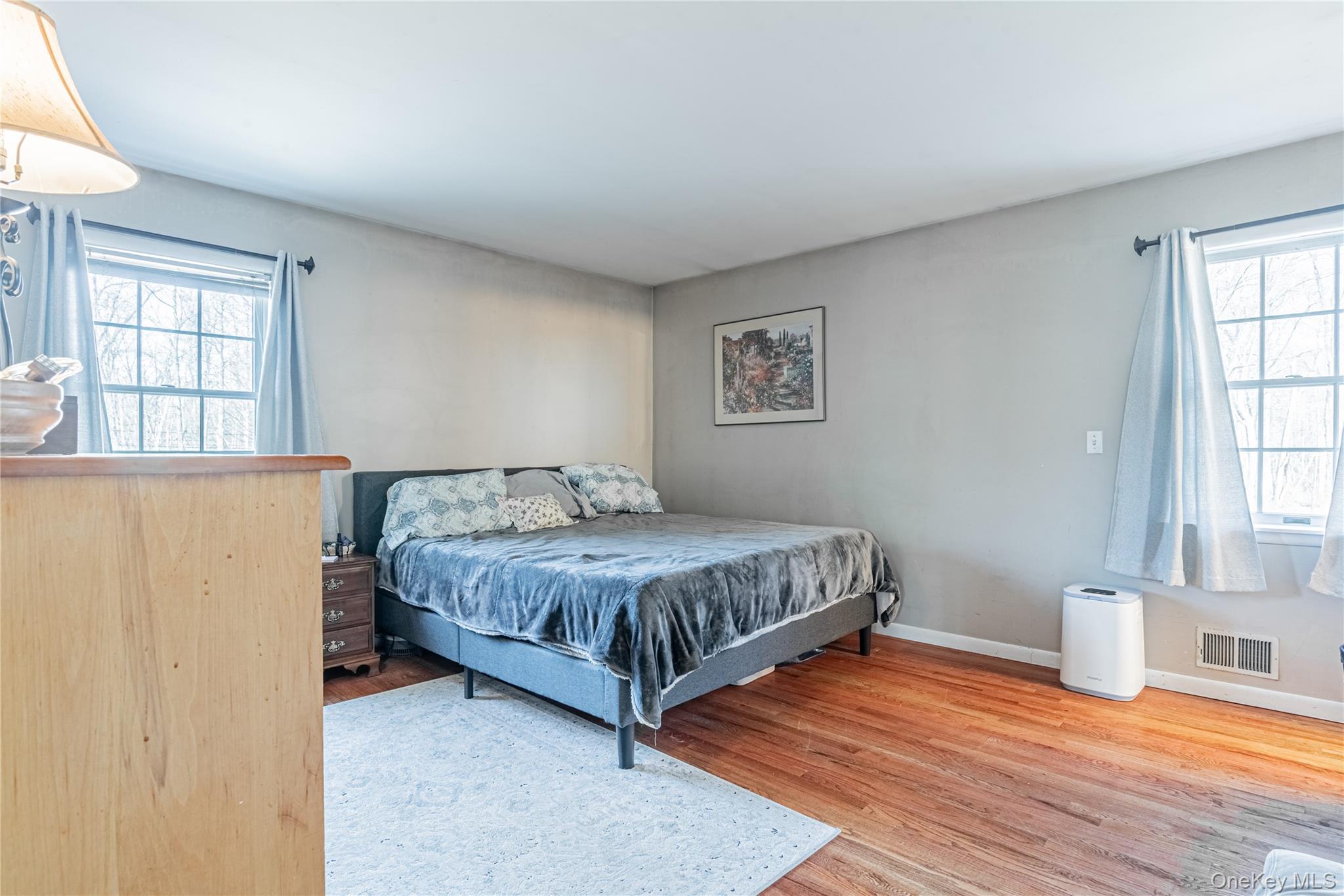 105 Oak Ridge Road Hopewell Junction, NY 12533 - Photo 21 of 32 a bedroom with a bed and wooden floor