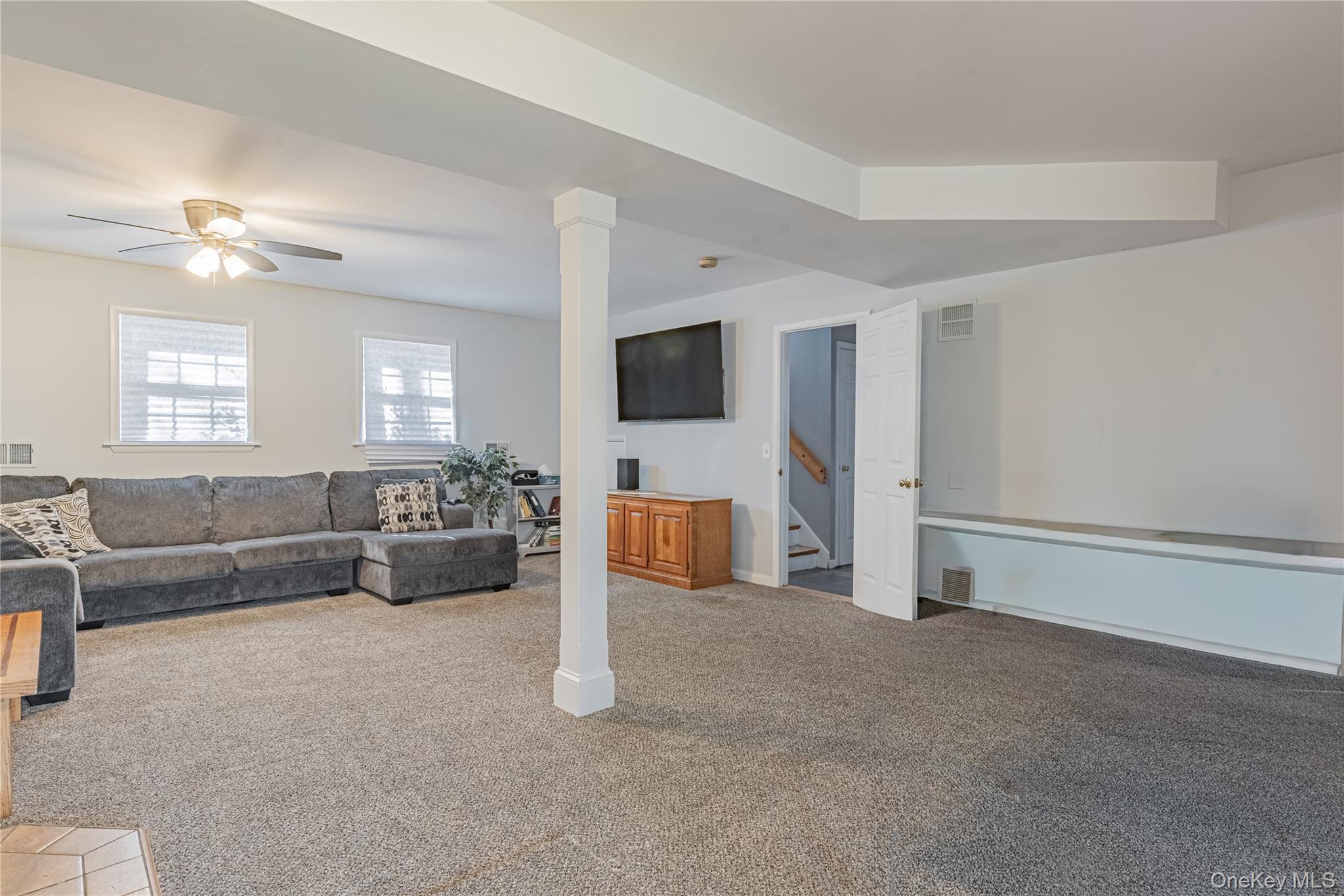 105 Oak Ridge Road Hopewell Junction, NY 12533 - Photo 25 of 32 a living room with furniture and a flat screen tv