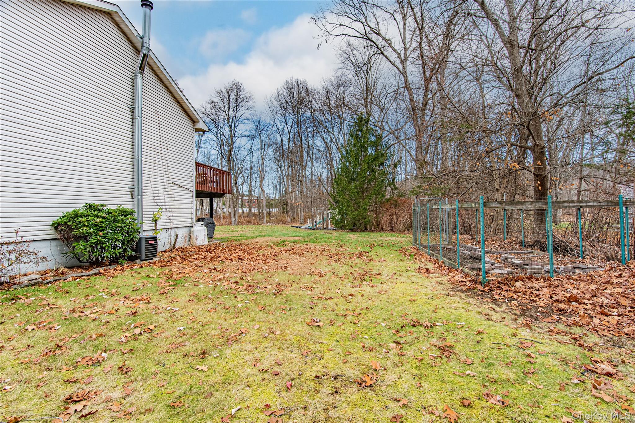 105 Oak Ridge Road Hopewell Junction, NY 12533 - Photo 30 of 32 a backyard of a house with large trees