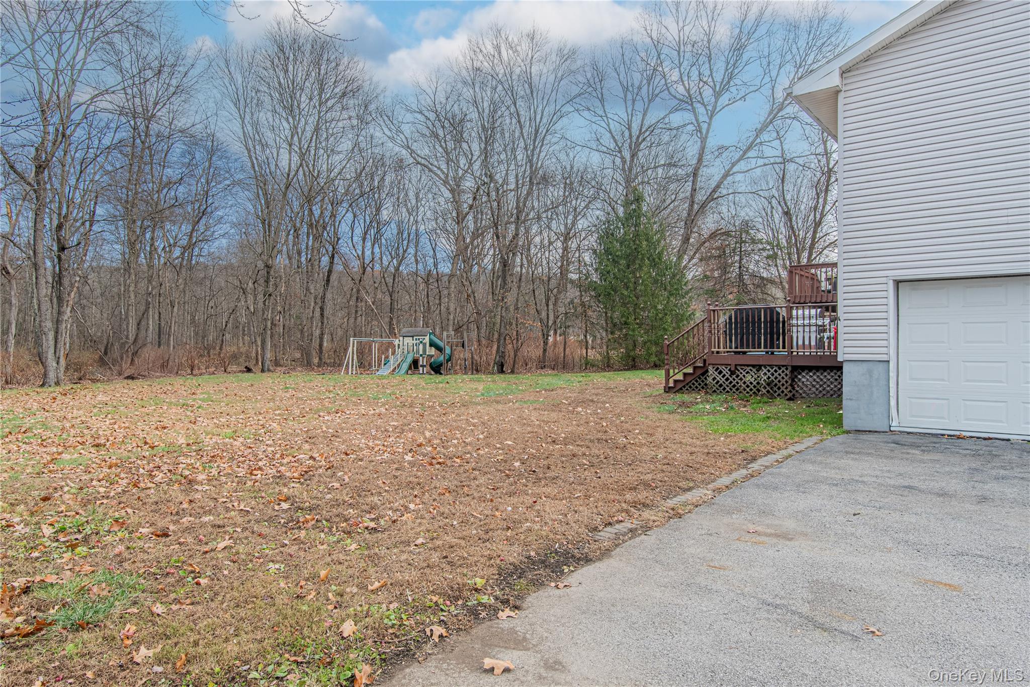 105 Oak Ridge Road Hopewell Junction, NY 12533 - Photo 5 of 32 a house with trees in front of it