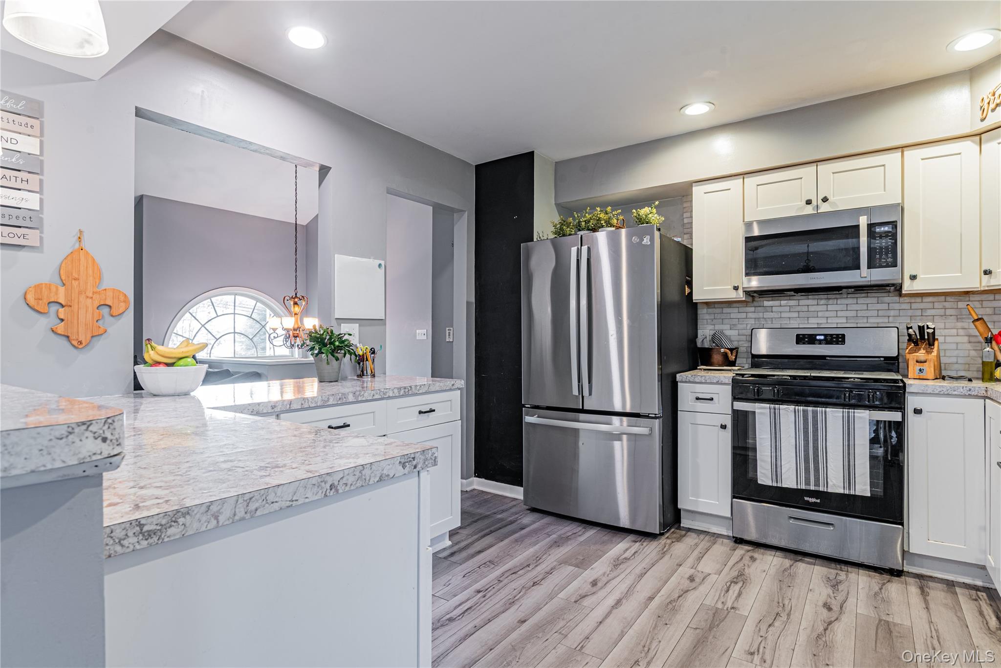 105 Oak Ridge Road Hopewell Junction, NY 12533 - Photo 8 of 32 a kitchen with stainless steel appliances kitchen island granite countertop a refrigerator and a stove