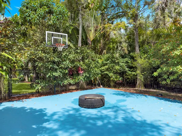 a living room with furniture gym equipment and a large window
