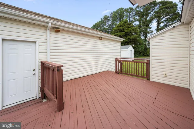 a view of a porch with wooden floor