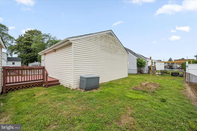a view of a backyard with plants and a backyard