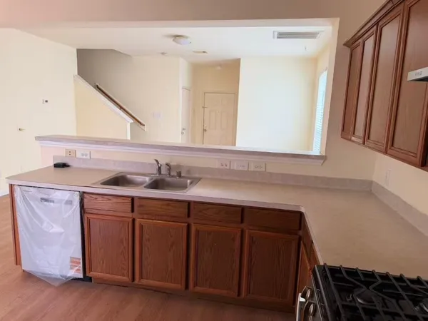 a spacious bathroom with a sink and a mirror